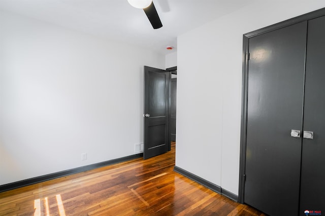 3018 S 42nd St, Lincoln, NE 68506 - unfurnished bedroom featuring hardwood / wood-style flooring, a closet, and a ceiling fan