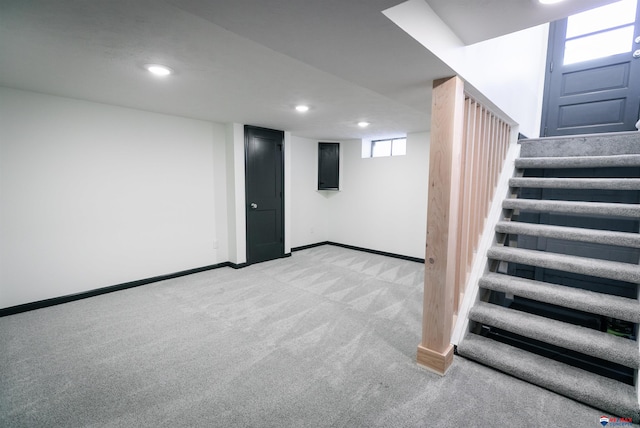 3018 S 42nd St, Lincoln, NE 68506 - basement featuring light colored carpet, stairway, and recessed lighting