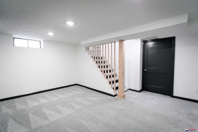 3018 S 42nd St, Lincoln, NE 68506 - below grade area with carpet floors, recessed lighting, and stairway