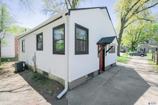 3018 S 42nd St, Lincoln, NE 68506 - view of home's exterior featuring a cooling unit and driveway