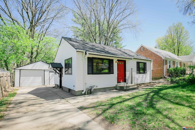 3018 S 42nd St, Lincoln, NE 68506 - view of front of home featuring an outdoor structure, a garage, driveway, and roof with shingles