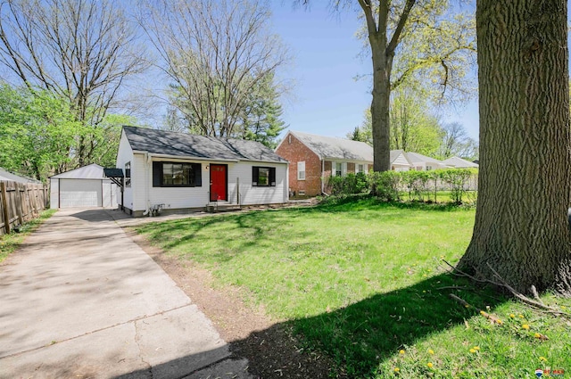 3018 S 42nd St, Lincoln, NE 68506 - bungalow featuring an outbuilding, a detached garage, and driveway