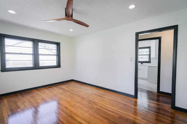 3018 S 42nd St, Lincoln, NE 68506 - unfurnished room with hardwood / wood-style floors, ceiling fan, and recessed lighting