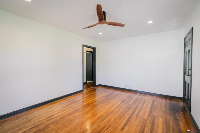 3018 S 42nd St, Lincoln, NE 68506 - empty room with wood finished floors, ceiling fan, and recessed lighting