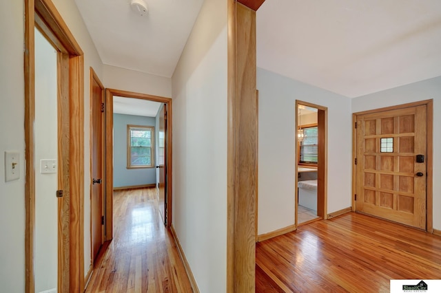 2340 S 36th St, Lincoln, NE 68506 - hallway featuring light wood-type flooring and baseboards