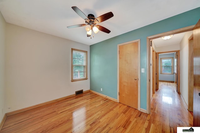 2340 S 36th St, Lincoln, NE 68506 - unfurnished bedroom with light wood finished floors and ceiling fan