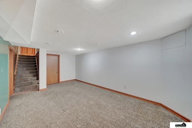 2340 S 36th St, Lincoln, NE 68506 - finished basement with light carpet, stairway, and recessed lighting