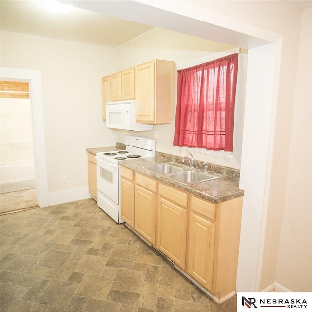 1548 E 5th St, Fremont, NE 68025 - kitchen featuring white appliances and light brown cabinetry