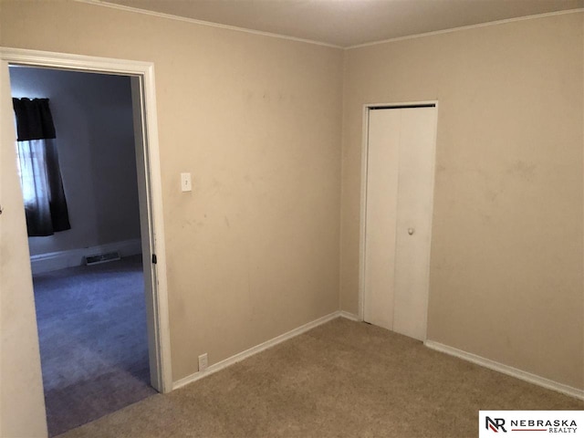 1548 E 5th St, Fremont, NE 68025 - carpeted empty room with ornamental molding and baseboards