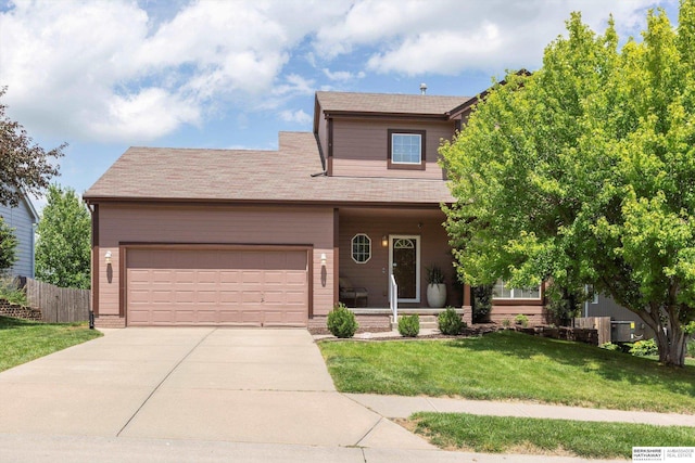 14628 Kansas Ave, Omaha, NE 68116 - view of front of house with a garage, driveway, and a porch