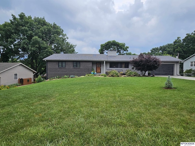 11821 Shirley St, Omaha, NE 68144 - ranch-style house with a chimney, a garage, a front lawn, and concrete driveway