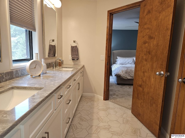 11821 Shirley St, Omaha, NE 68144 - ensuite bathroom featuring double vanity and tile patterned floors