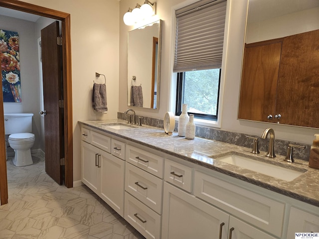11821 Shirley St, Omaha, NE 68144 - bathroom with double vanity and toilet