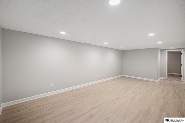 1409 Nelson Ln, Fremont, NE 68025 - finished below grade area featuring light wood finished floors and recessed lighting