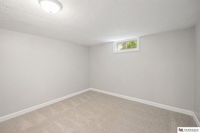 1409 Nelson Ln, Fremont, NE 68025 - basement with carpet and a textured ceiling