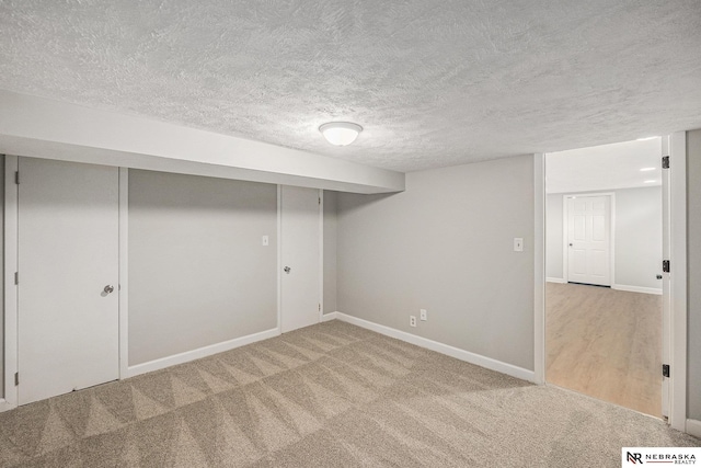 1409 Nelson Ln, Fremont, NE 68025 - finished below grade area with carpet flooring and a textured ceiling