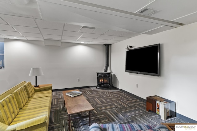 6024 Poppleton Ave, Omaha, NE 68106 - unfurnished living room featuring a wood stove and carpet
