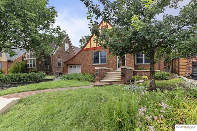 6024 Poppleton Ave, Omaha, NE 68106 - tudor home with brick siding and an attached garage
