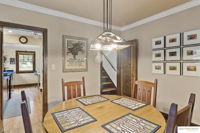 6024 Poppleton Ave, Omaha, NE 68106 - dining room with ornamental molding, wood finished floors, and stairs