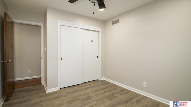 4211 S 36th St, Lincoln, NE 68506 - unfurnished bedroom featuring wood finished floors, a closet, and ceiling fan