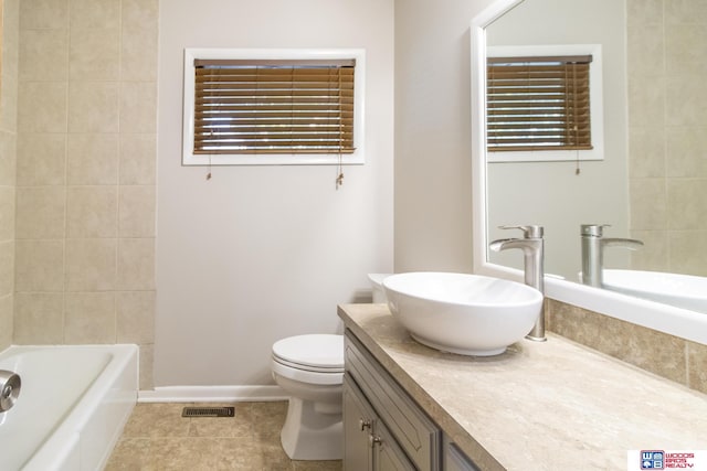 4211 S 36th St, Lincoln, NE 68506 - full bathroom with vanity, tile patterned floors, and bathing tub / shower combination