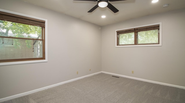 4211 S 36th St, Lincoln, NE 68506 - spare room with healthy amount of natural light, recessed lighting, carpet, a ceiling fan, and a smoke detector