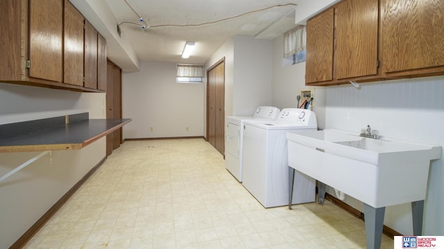 4211 S 36th St, Lincoln, NE 68506 - laundry area featuring light flooring, cabinet space, and separate washer and dryer