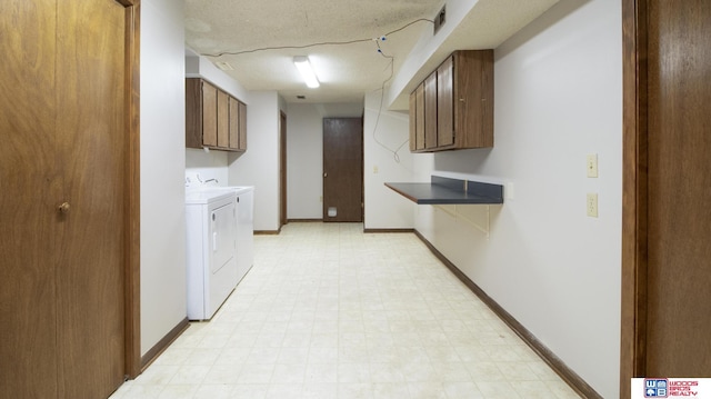4211 S 36th St, Lincoln, NE 68506 - laundry room with washing machine and clothes dryer, cabinet space, and light flooring