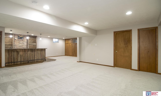 4211 S 36th St, Lincoln, NE 68506 - finished basement featuring recessed lighting, light colored carpet, and bar