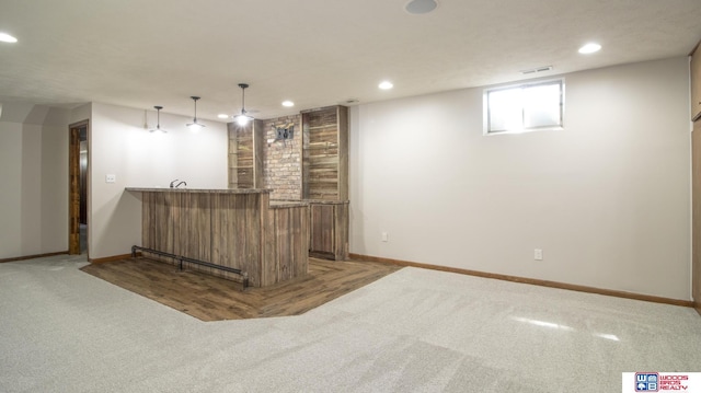 4211 S 36th St, Lincoln, NE 68506 - indoor wet bar with light colored carpet, recessed lighting, and hanging light fixtures