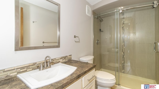 4211 S 36th St, Lincoln, NE 68506 - full bathroom featuring a stall shower, vanity, and tasteful backsplash