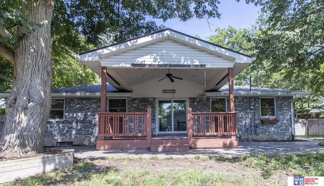 4211 S 36th St, Lincoln, NE 68506 - view of front facade with ceiling fan, brick siding, and a wooden deck