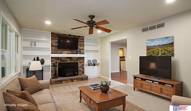 4211 S 36th St, Lincoln, NE 68506 - living area featuring a ceiling fan, a stone fireplace, and recessed lighting