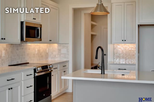 640 Eloise Ave, Lincoln, NE 68520 - kitchen featuring appliances with stainless steel finishes, decorative backsplash, and hanging light fixtures