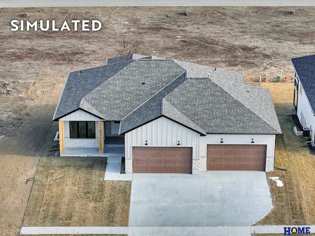 640 Eloise Ave, Lincoln, NE 68520 - view of front of home featuring roof with shingles, board and batten siding, an attached garage, and driveway