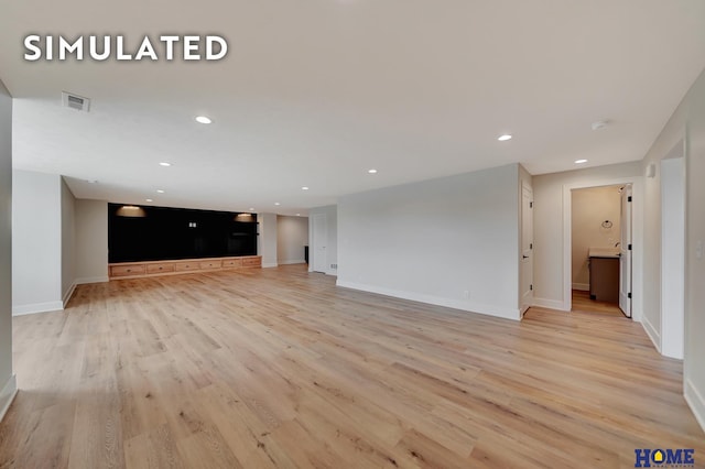 640 Eloise Ave, Lincoln, NE 68520 - unfurnished living room featuring light wood-style flooring and recessed lighting