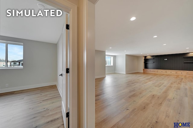 640 Eloise Ave, Lincoln, NE 68520 - unfurnished living room with light wood-type flooring and recessed lighting