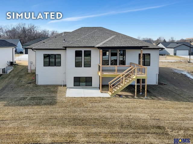 640 Eloise Ave, Lincoln, NE 68520 - rear view of house featuring a shingled roof, stairs, and a deck