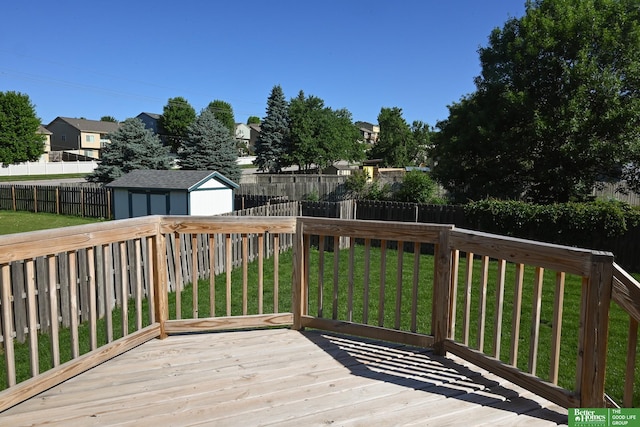 2412 Lewis And Clark Rd, Bellevue, NE 68123 - wooden terrace with a fenced backyard, a storage shed, and a residential view