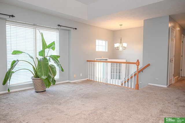 2412 Lewis And Clark Rd, Bellevue, NE 68123 - unfurnished room with carpet and a chandelier