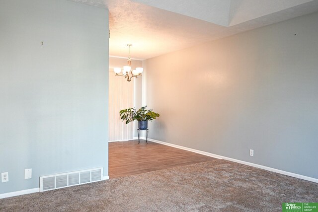 2412 Lewis And Clark Rd, Bellevue, NE 68123 - carpeted spare room with a chandelier and baseboards