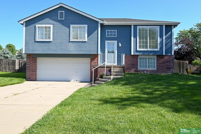2412 Lewis And Clark Rd, Bellevue, NE 68123 - split foyer home featuring brick siding, a garage, and concrete driveway