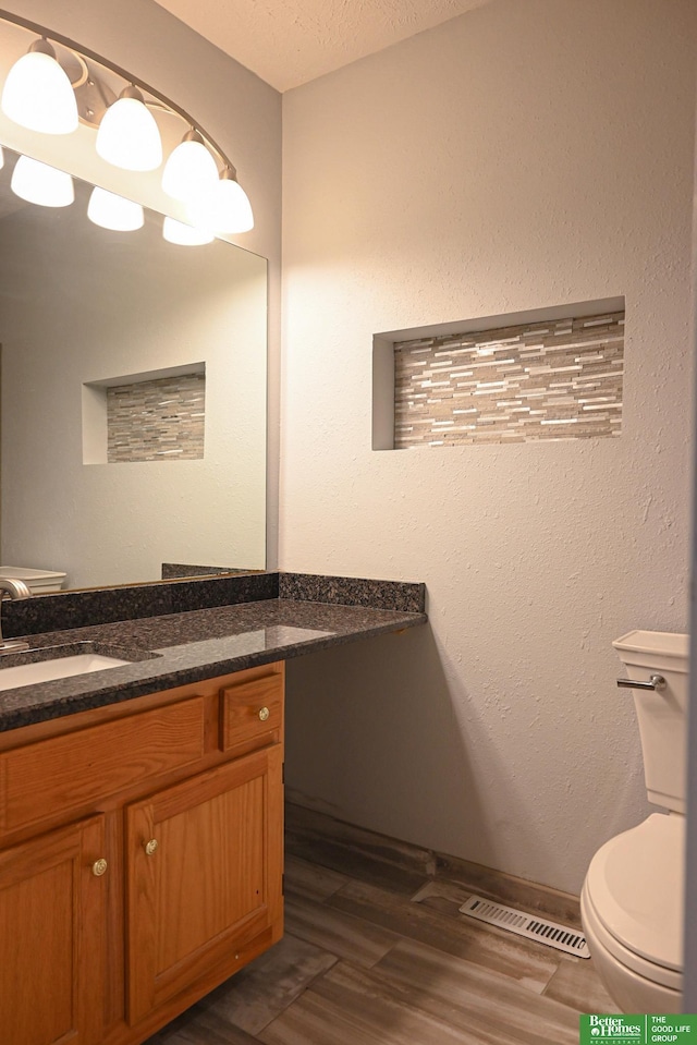 2412 Lewis And Clark Rd, Bellevue, NE 68123 - half bath with vanity and wood finished floors