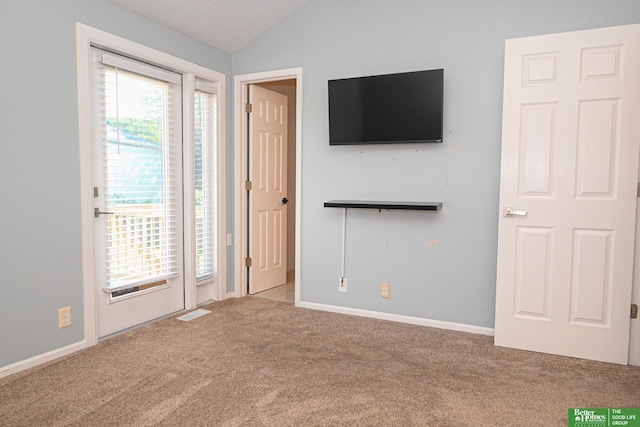2412 Lewis And Clark Rd, Bellevue, NE 68123 - unfurnished bedroom with carpet, lofted ceiling, and access to outside