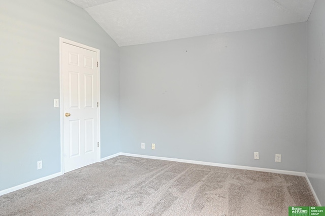 2412 Lewis And Clark Rd, Bellevue, NE 68123 - carpeted empty room featuring vaulted ceiling and baseboards