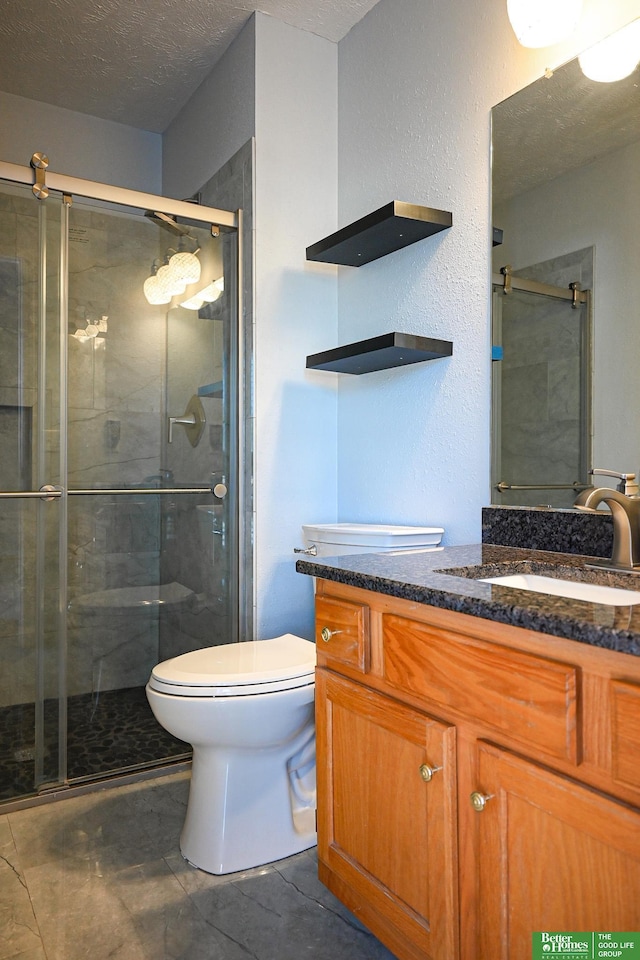2412 Lewis And Clark Rd, Bellevue, NE 68123 - bathroom featuring vanity, a stall shower, and a textured ceiling