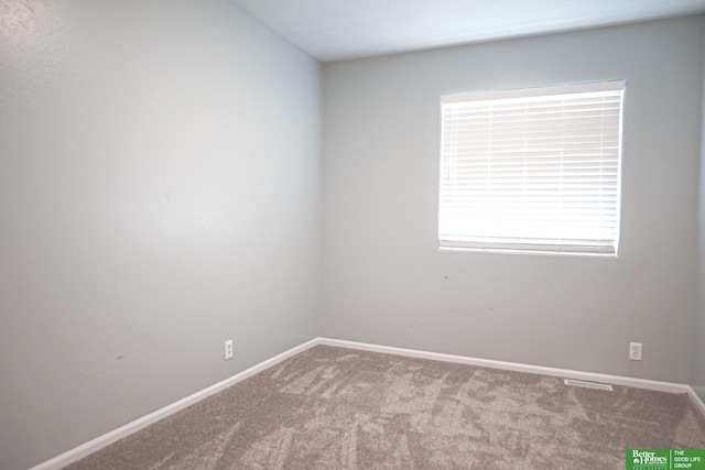 2412 Lewis And Clark Rd, Bellevue, NE 68123 - carpeted spare room featuring baseboards