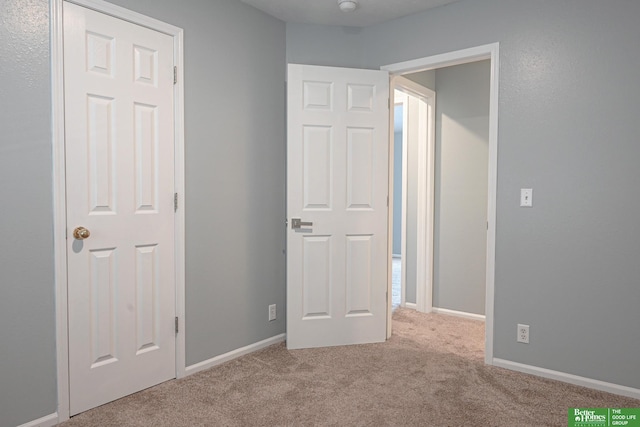 2412 Lewis And Clark Rd, Bellevue, NE 68123 - unfurnished bedroom featuring carpet and baseboards