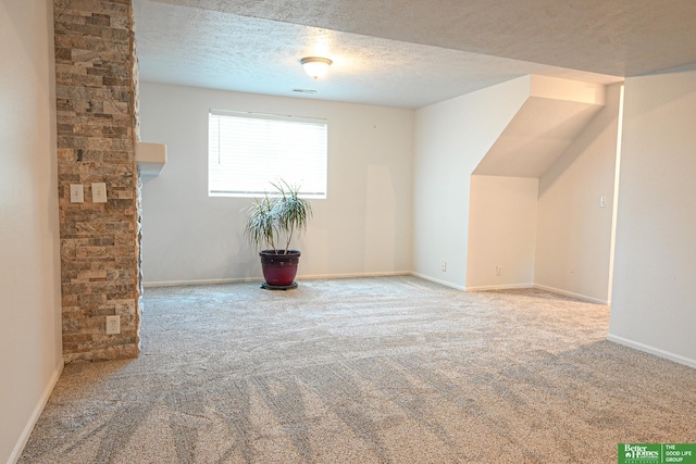 2412 Lewis And Clark Rd, Bellevue, NE 68123 - bonus room with carpet floors and a textured ceiling