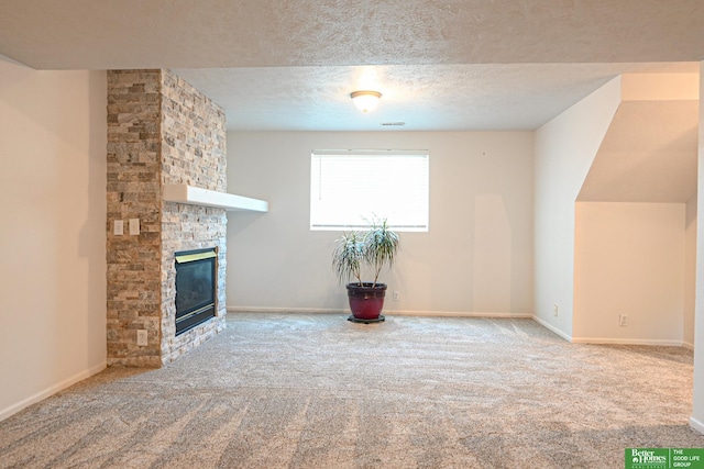 2412 Lewis And Clark Rd, Bellevue, NE 68123 - unfurnished living room featuring carpet, a fireplace, and a textured ceiling